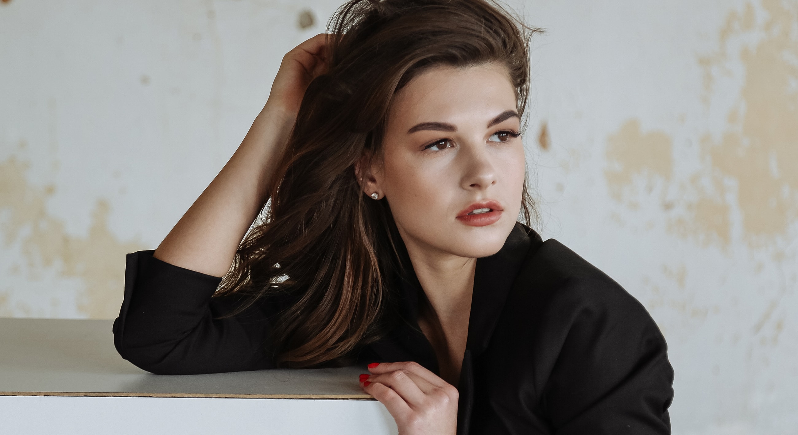 Woman with long hair in stylish pose.