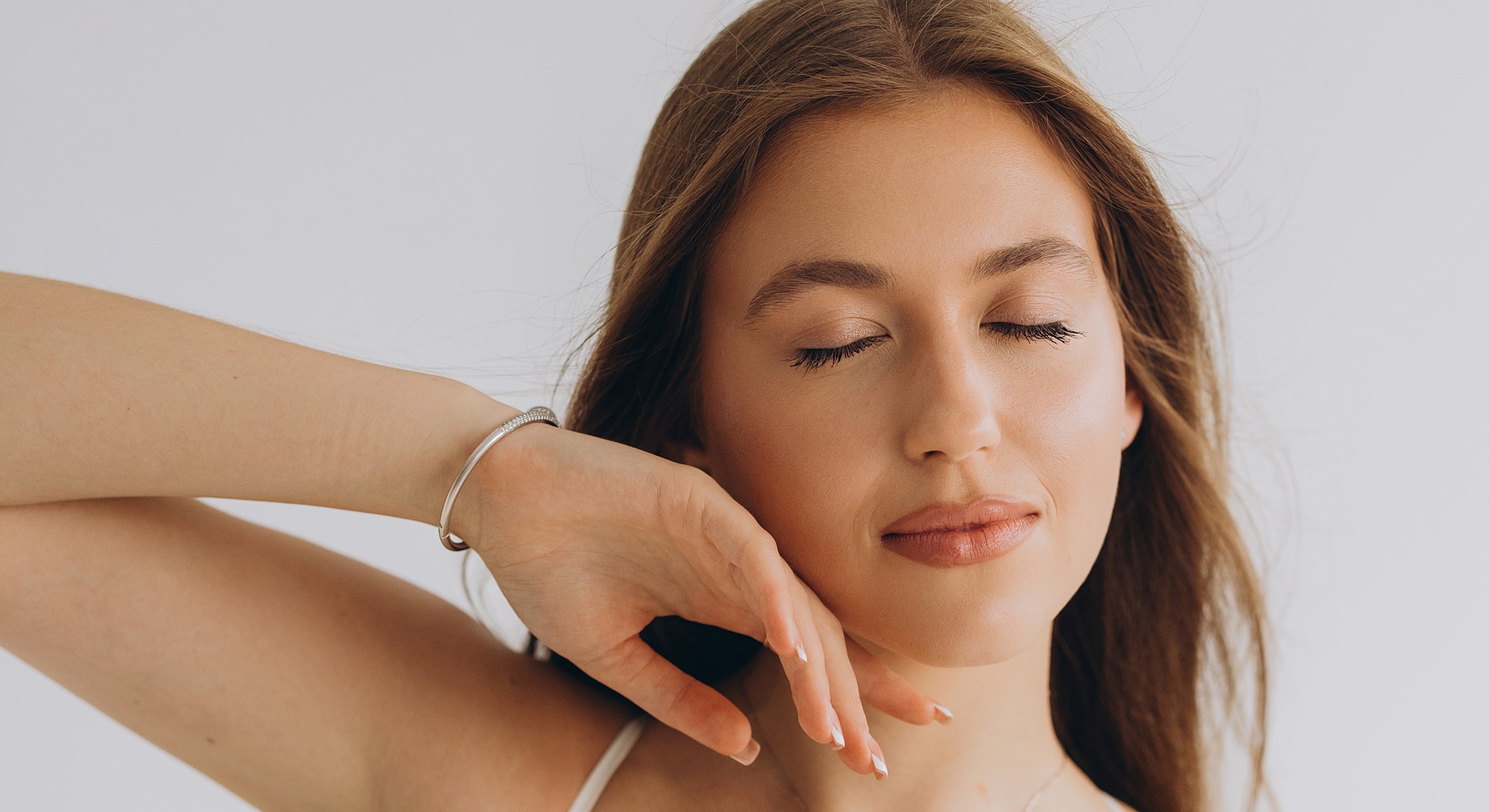 Woman with closed eyes and serene expression.